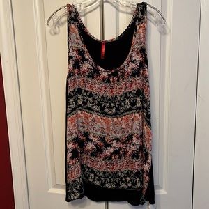 Sleeveless floral print top with solid black back